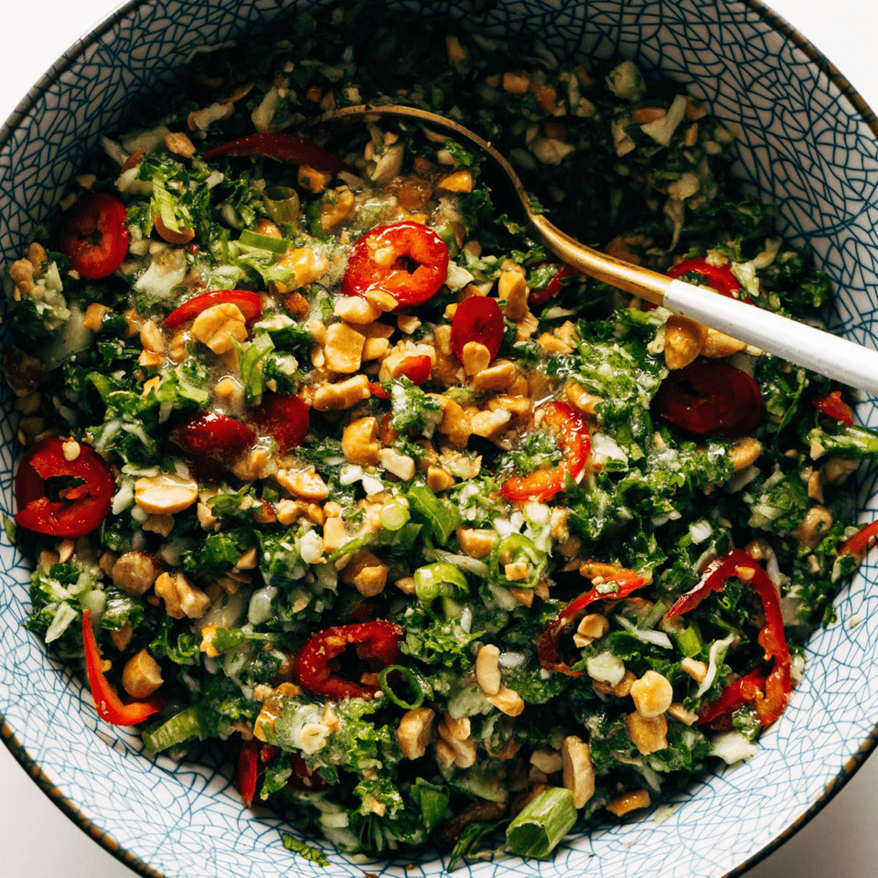 Peanut kale crunch salad in a bowl. 
